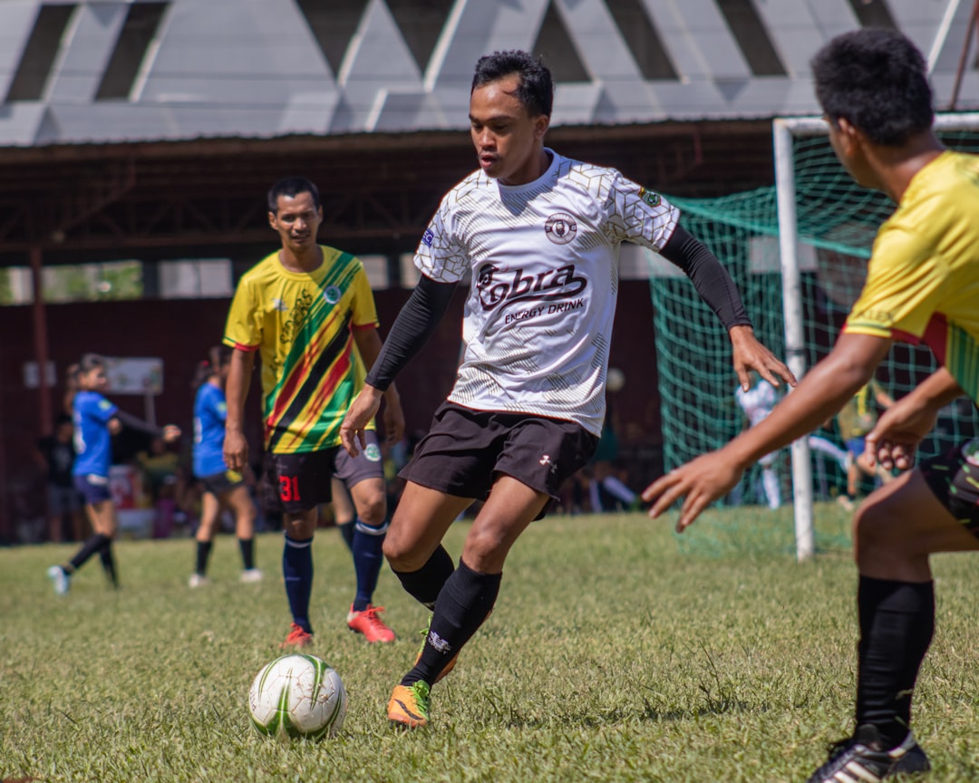 a group of young men playing a game of soccer