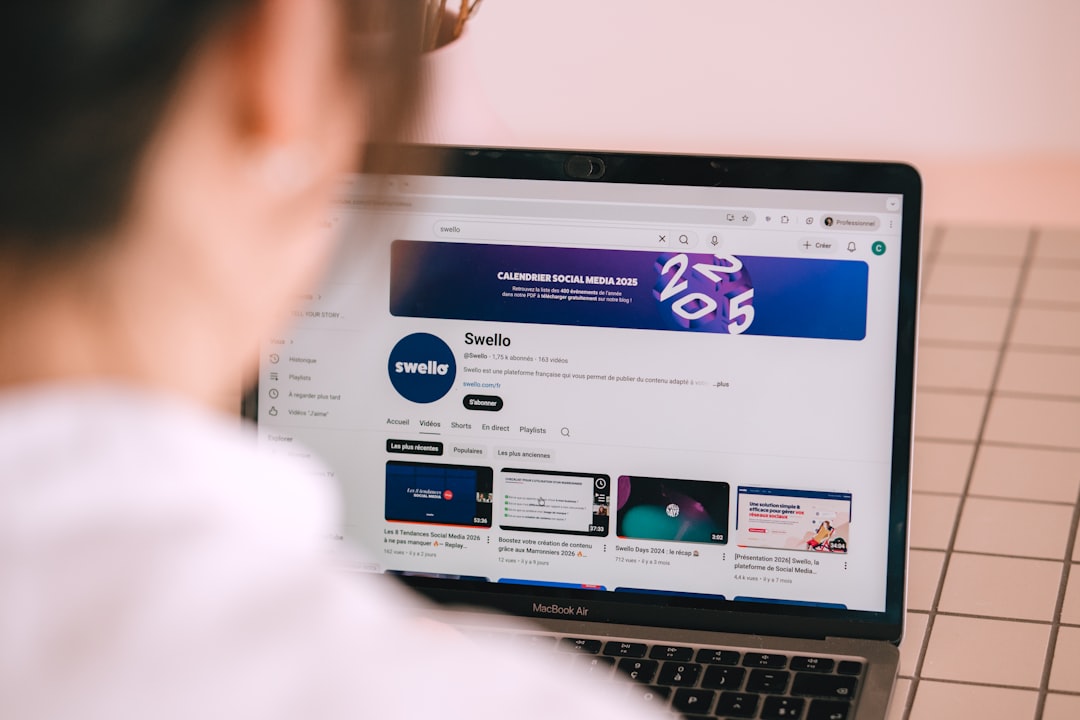 Person watching a youtube channel on a laptop