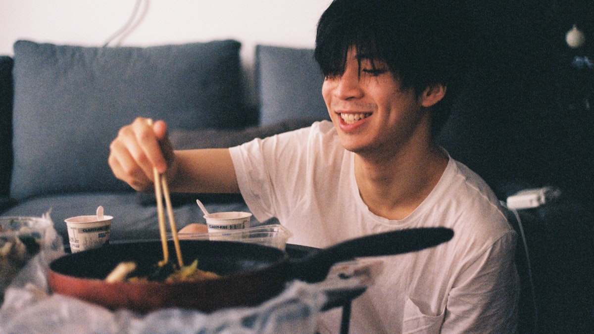 happy person eating korean food