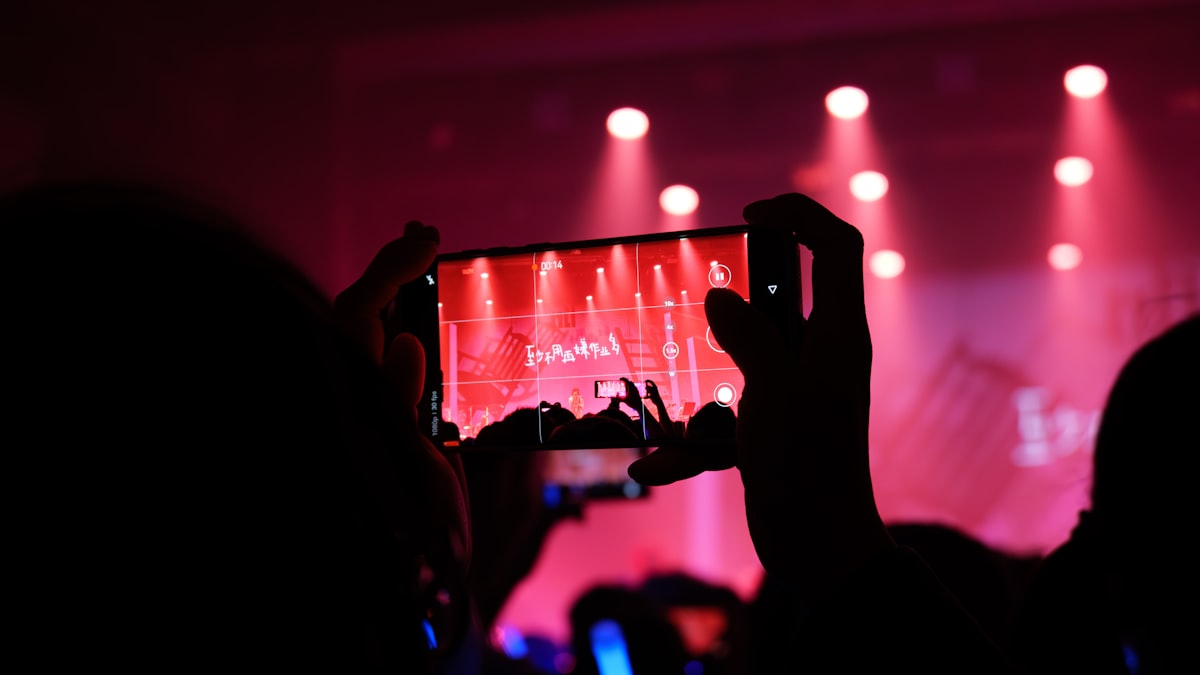 kpop fan watching concert on tablet
